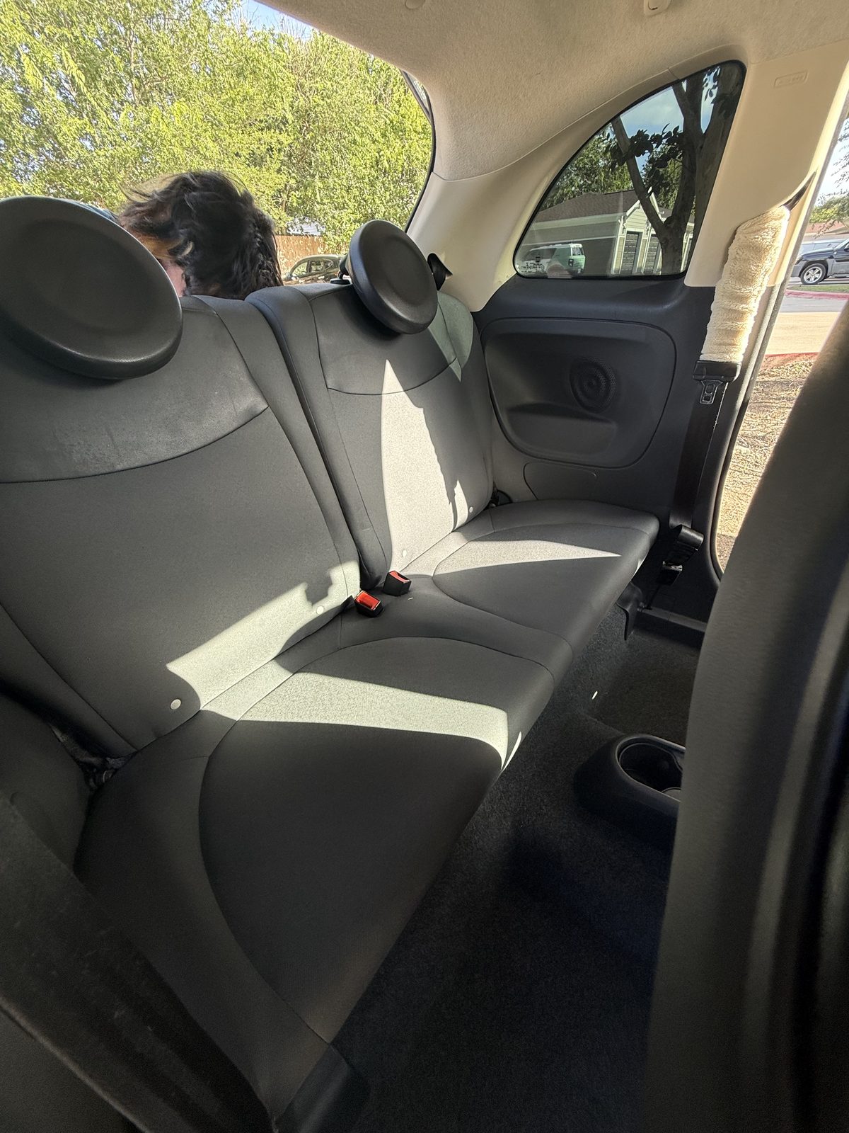 The same compact-car back seat cleaned and refreshed after detailing