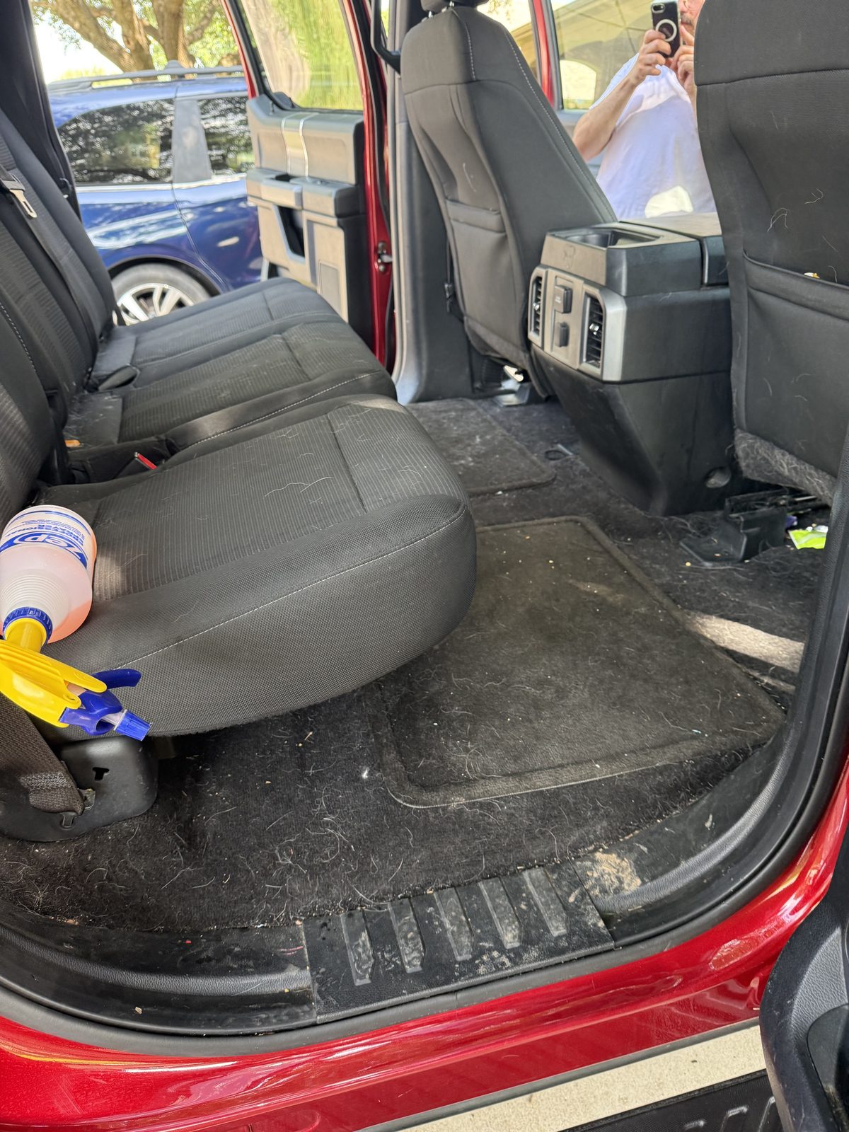 Truck passenger-side rear interior, dirty before detailing